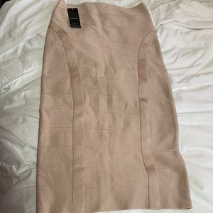 Nwt bebe bandage midi skirt beige pink size small